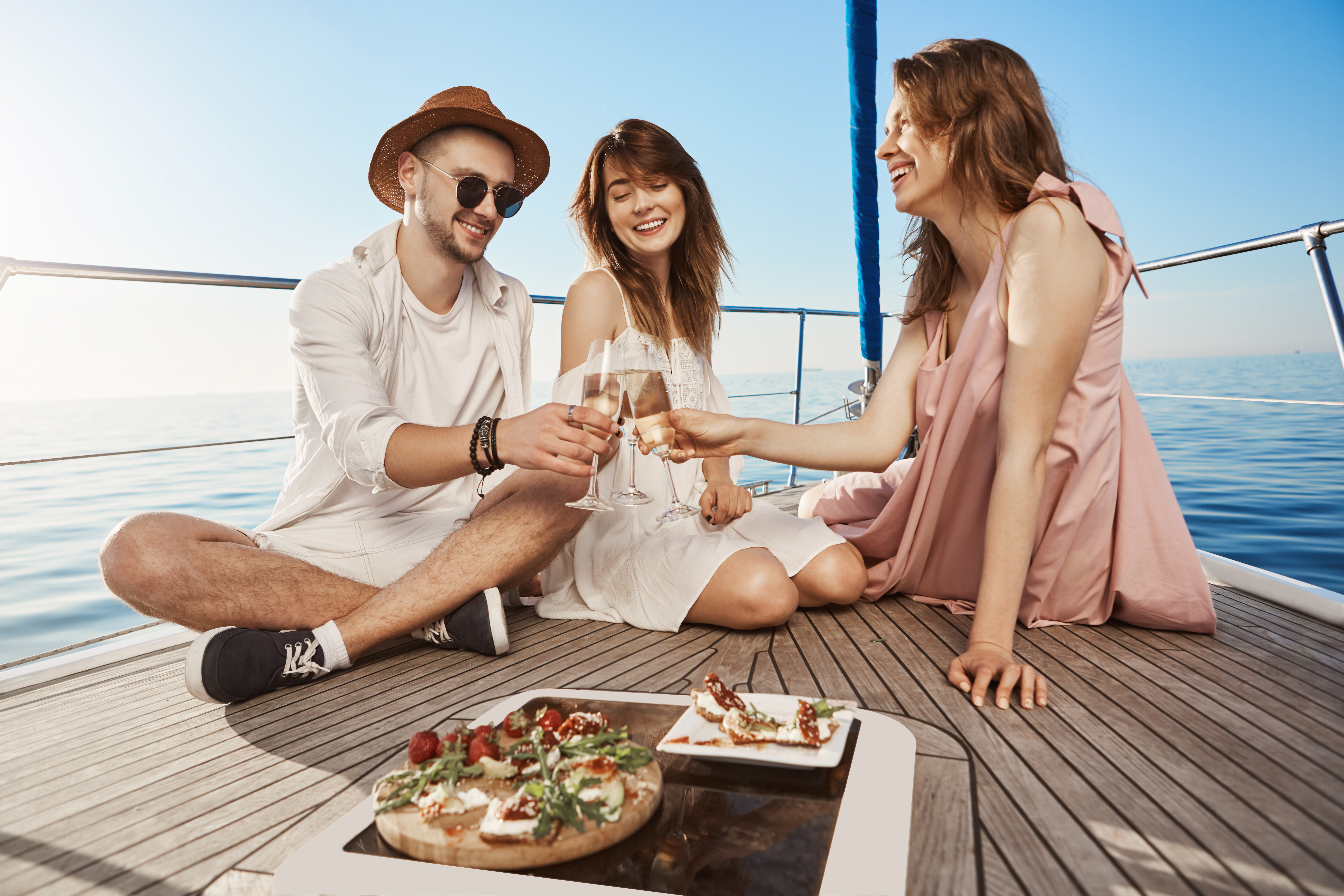 Friends having champagne on boat